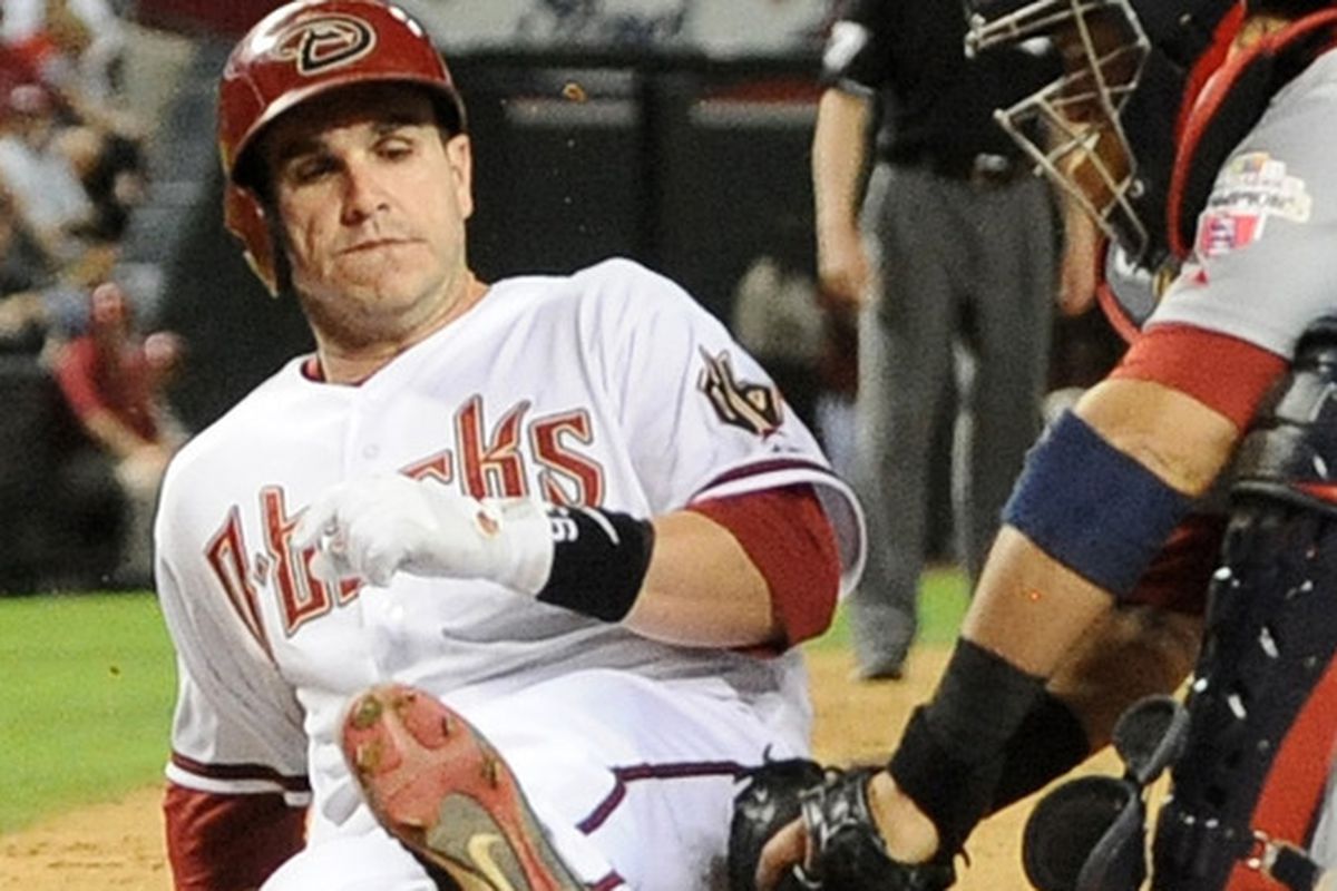 May. 7, 2012; Miguel Montero is tagged at home plate by Yadier Molina during the fourth inning at Chase Field. 