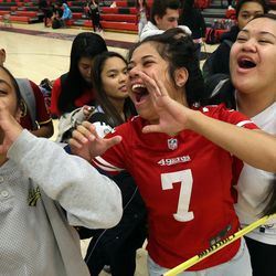 Samantha Kivalu, Teukisia Vaitai and Sinai Tupou cheer during a Spirit Week dodgeball game at West High School in Salt Lake City Tuesday, March 15, 2016. The theme for this year's Spirit Week is "Nightmare on 3rd West."