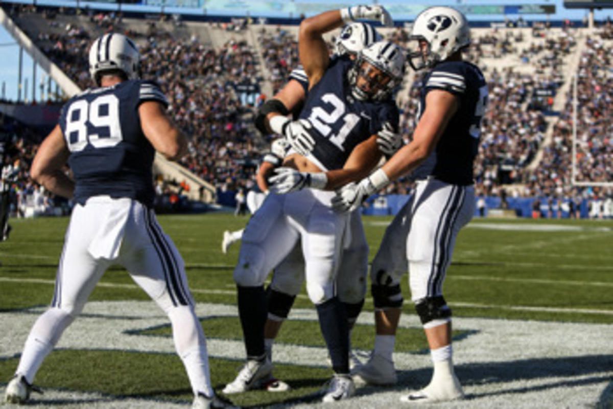 Brigham Young Cougars linebacker Harvey Langi (21) celebrates after running for a touchdown, putting BYU up 27-9 after the PAT, during a game against the UMass Minutemen at LaVell Edwards Stadium in Provo on Saturday, Nov. 19, 2016. 