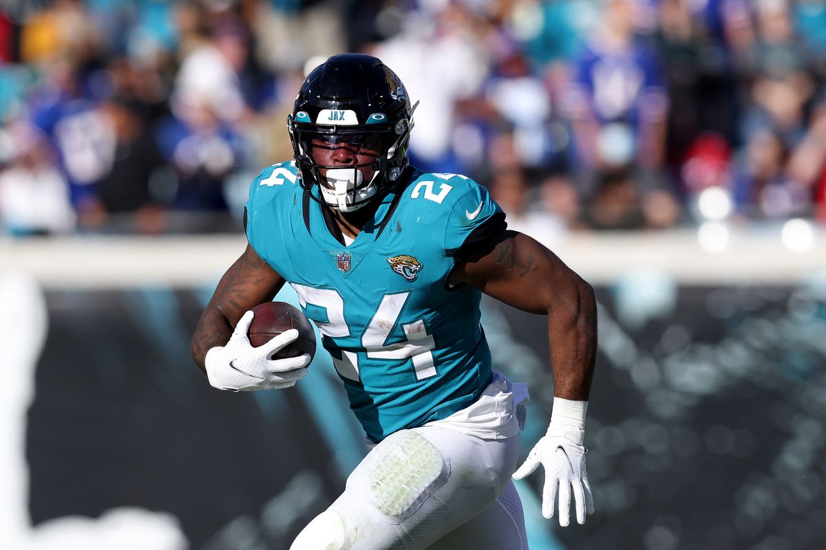 Carlos Hyde #24 of the Jacksonville Jaguars runs for yardage during the game against the Buffalo Bills at TIAA Bank Field on November 07, 2021 in Jacksonville, Florida.