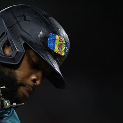 SEATTLE, WASHINGTON - SEPTEMBER 09: Carlos Santana #41 of the Seattle Mariners celebrates his home run with a bubble gum wrapper on his helmet during the seventh inning against the Atlanta Braves at T-Mobile Park on September 09, 2022 in Seattle, Washington.