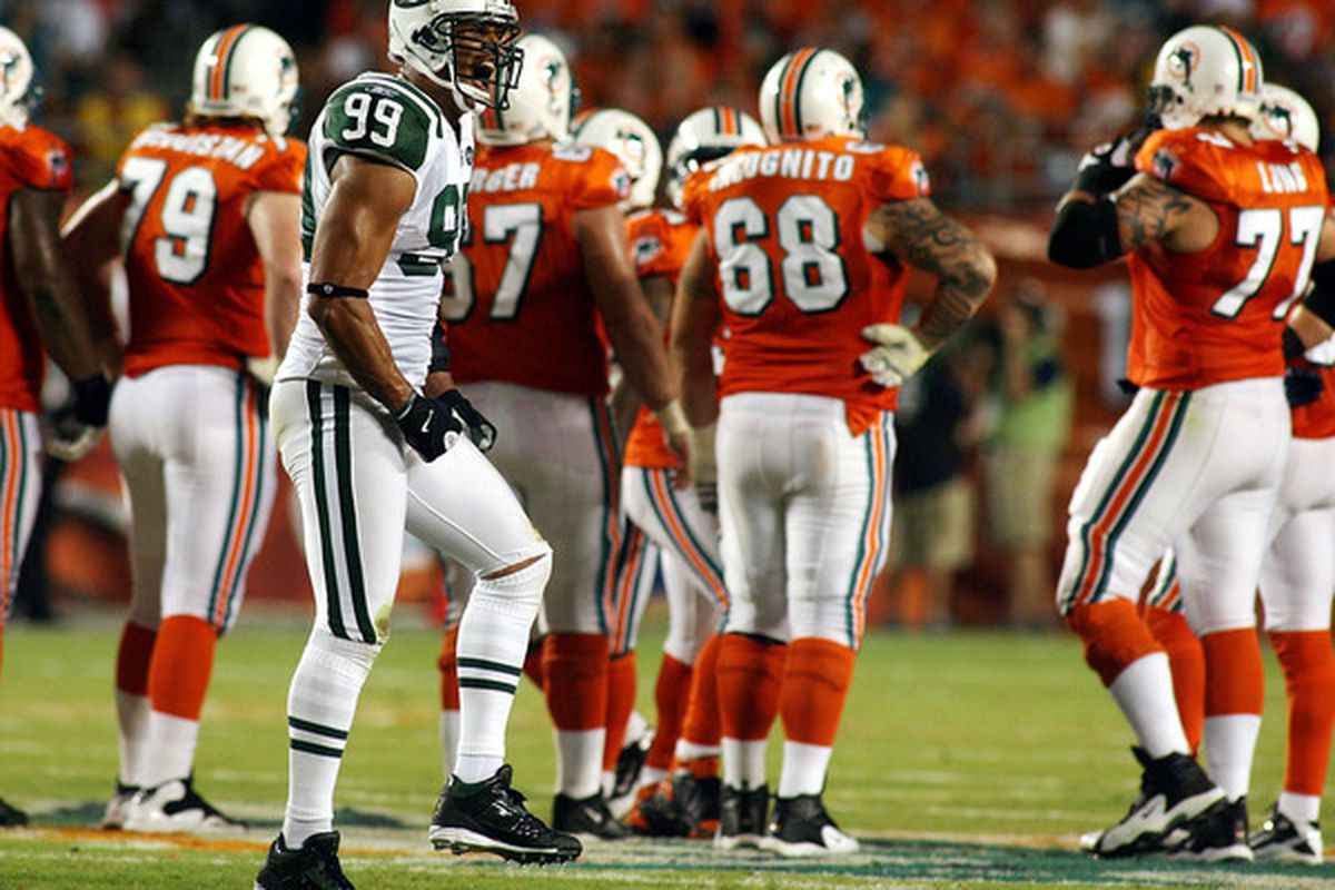 MIAMI - SEPTEMBER 26:  Defensive end Jason Taylor #99 of the New York Jets celebrates a sack against his old team the Miami Dolphins at Sun Life Stadium on September 26 2010 in Miami Florida.  (Photo by Marc Serota/Getty Images)