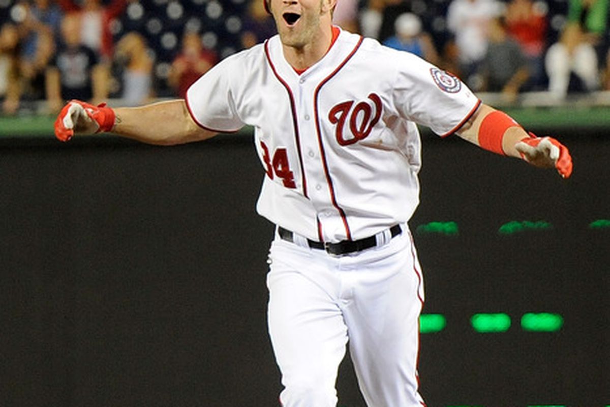 WASHINGTON, DC:  Bryce Harper #34 of the Washington Nationals celebrates after hitting the game winning RBI single in the twelfth inning against the New York Mets at Nationals Park in Washington, DC.  (Photo by Patrick McDermott/Getty Images)