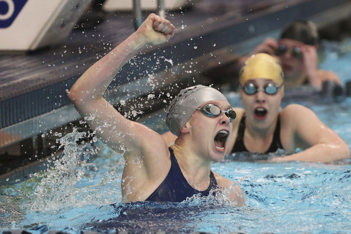 Ridgeline’s Carly Eubanks, left, and Snow Canyon’s Gretchen Snelders tie for first in the 100-yard freestyle in the 4A state swimming meet in Provo on Saturday, Feb. 8, 2020.