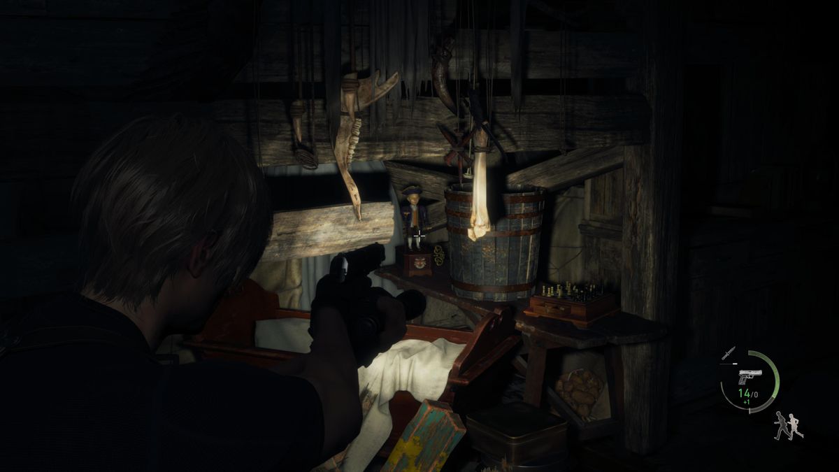Leon S Kennedy aims at a Clockwork Castellan on the Village Chief Manor’s attic in Resident Evil 4 remake