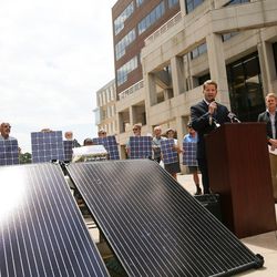 Ryan Evans, of Utah Solar Energy Association, speaks alongside other rooftop solar advocates at a press conference outside the Heber M. Wells Building in Salt Lake City before attending a Public Service Commission hearing on Wednesday, Aug. 9, 2017.