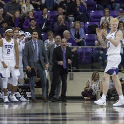Fisher applauds as the bench goes crazy after the Frogs’ drew an SMU charge.
