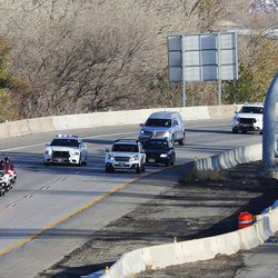 The body of Utah Highway Patrol trooper Eric Ellsworth, is transported on I-80 west from the Utah State Medical Examiner's office in Salt Lake City to Lindquist Mortuary in Ogden on Friday, Nov. 25, 2016.