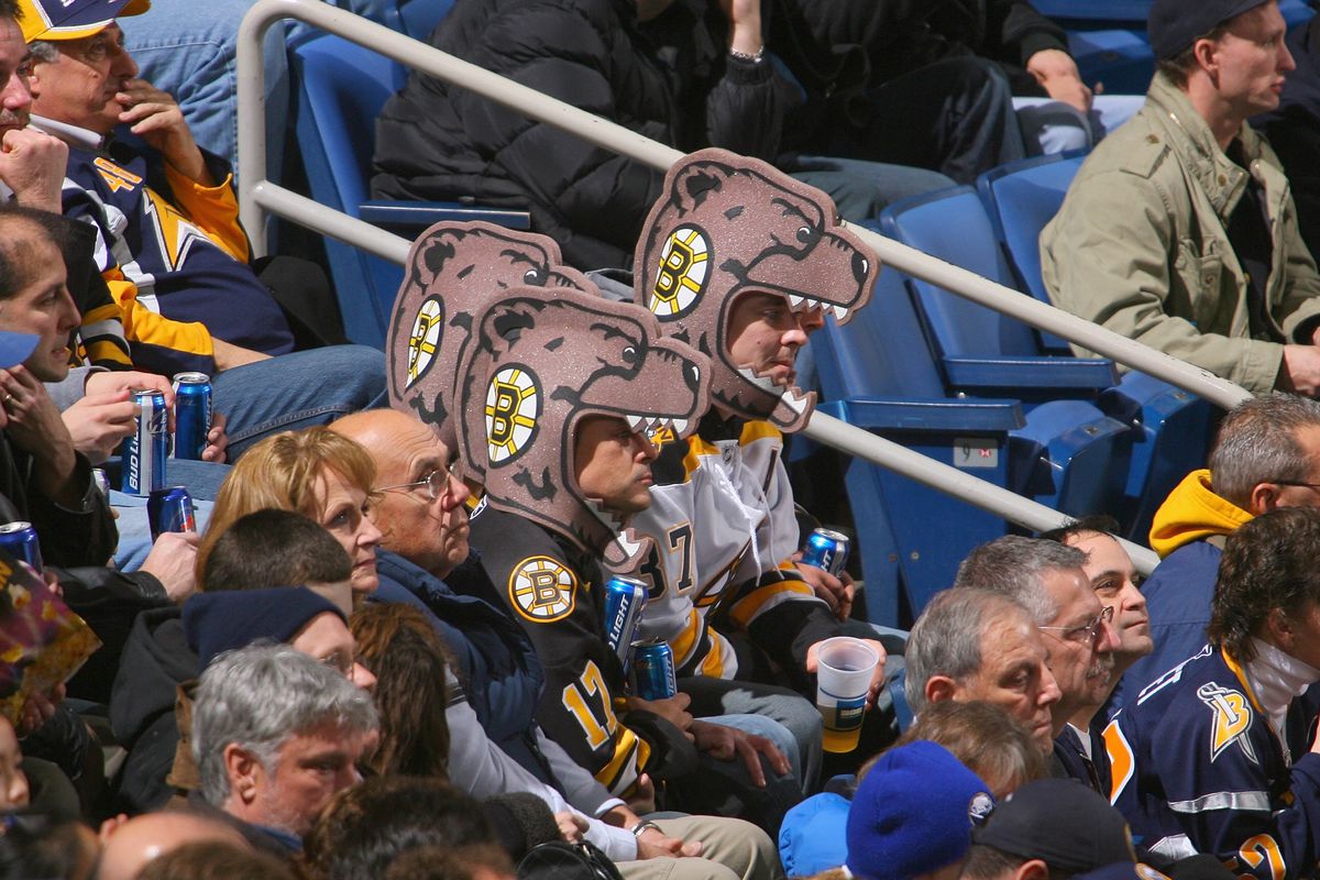 An intrepid trio of Bruins fans deep in enemy territory