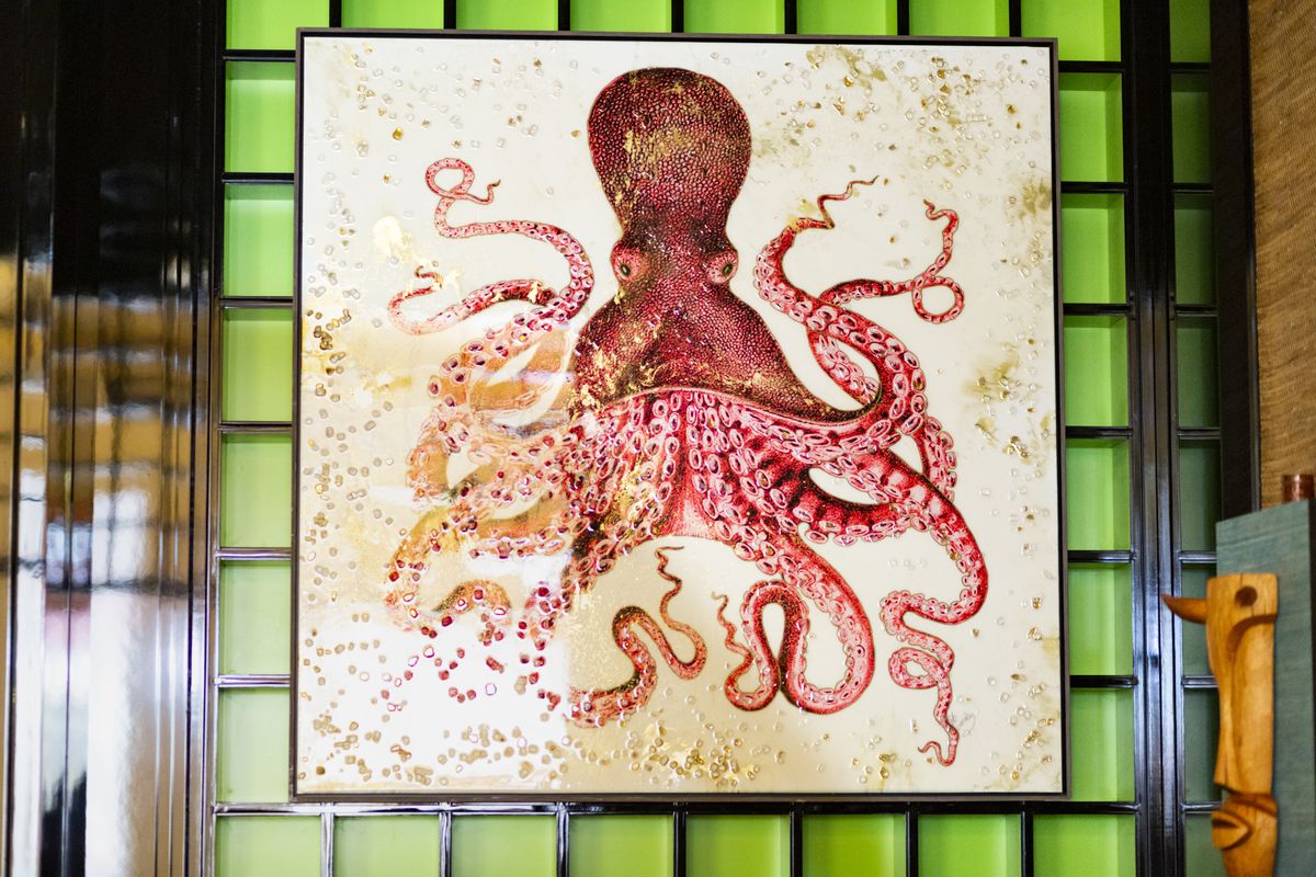 A framed picture of an octopus.