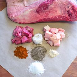 The ingredients: (top two l-r) Lean brisket meat, natural hog casing, brisket fat.<br>
(middle row l-r) Paprika, black pepper, garlic powder.<br>
(Bottom) Salt.