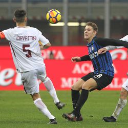 Facundo Colidio (C) of FC Internazionale competes for the ball with Stefano Ciavattini (L) and Andrea Marcucci (R) of AS Roma during the Primavera SuperCup match between FC Internazionale U19 and AS Roma U19 at Stadio Giuseppe Meazza on January 7, 2018 in Milan, Italy.