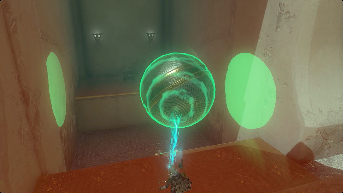 The Legend of Zelda: Tears of the Kingdom Link placing a large metal ball to reach a chest in Mayamats Shrine