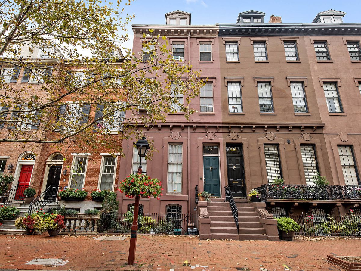 A series of rowhomes, including three tall brownstones in Philly’s Society Hill neighborhood.