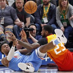 Sacramento Kings guard Buddy Hield (24) passes the ball as Utah Jazz forward Royce O'Neale (23) defends in the first half during an NBA basketball game Saturday, March 17, 2018, in Salt Lake City. (AP Photo/Rick Bowmer)