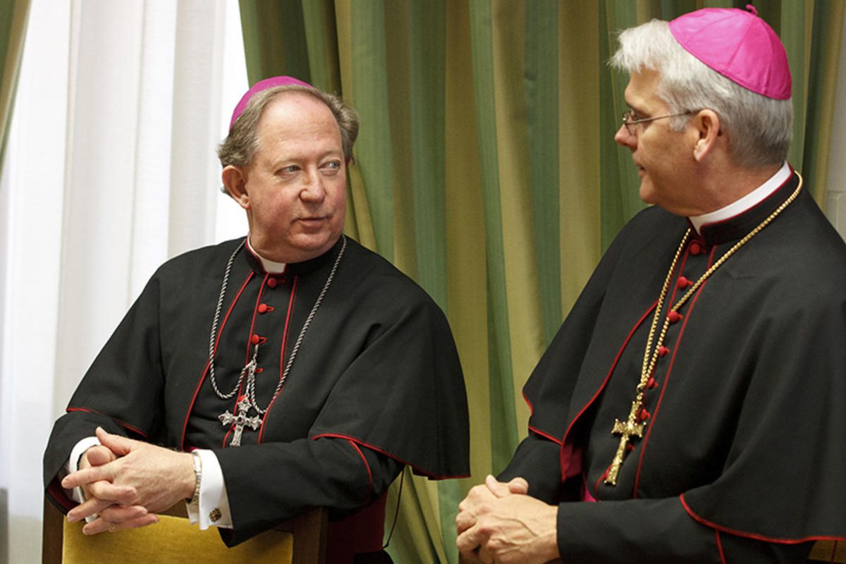 Bishop Patrick J. Zurek of Amarillo, Texas, left, and Archbishop Paul S. Coakley of Oklahoma City talk before a meeting of bishops from Texas, Oklahoma and Arkansas at the Congregation for Clergy on March 16 during their "ad limina" visits to the Vatican.
