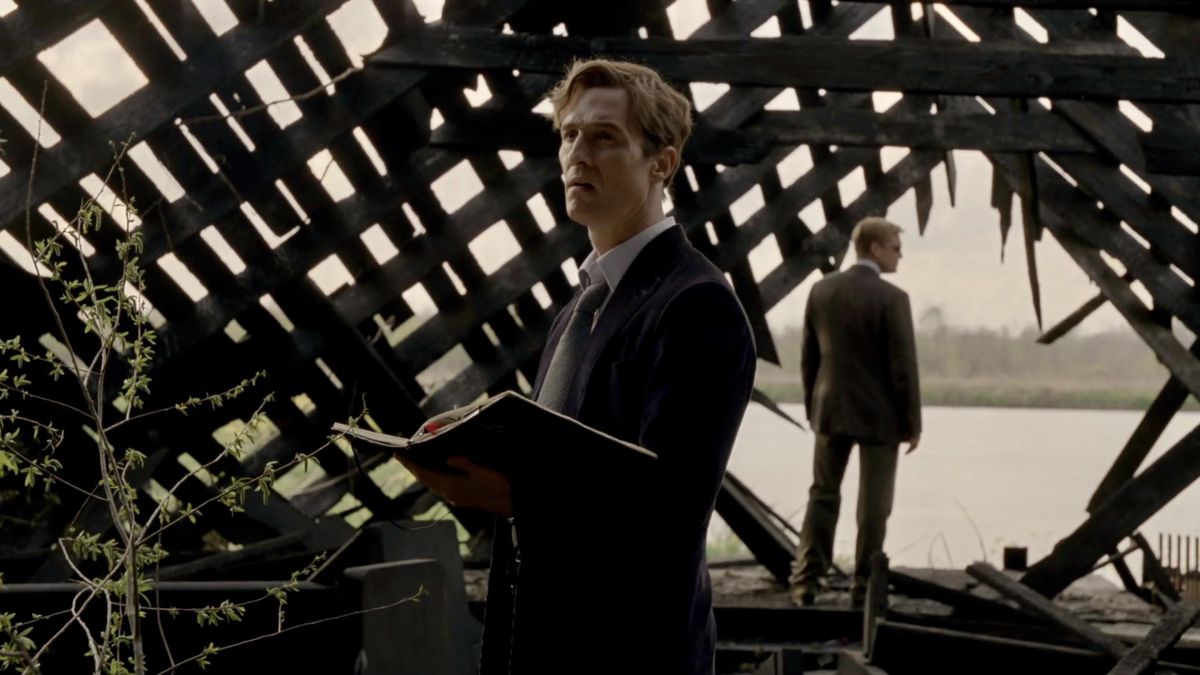 (L-R) Matthew McConaughey and Woody Harrelson standing in the wreckage of a dilapidated, burned down church in season one of True Detective.