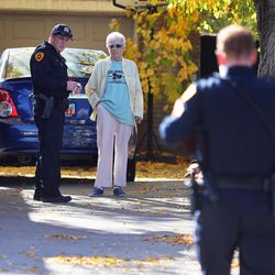 Salt Lake police interview people as they investigate a stabbing at 821 W. Fremont Ave. on Monday, Oct. 31, 2016.