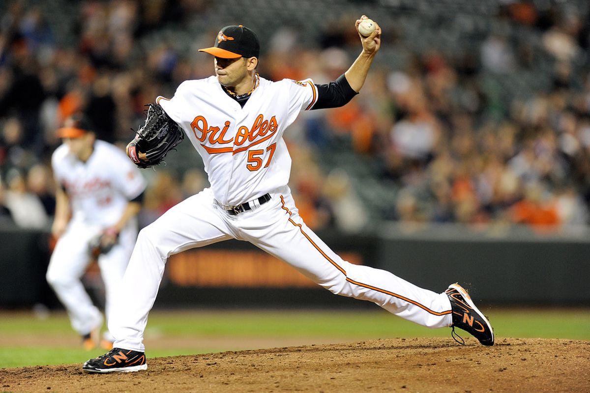 BALTIMORE, MD - APRIL 18:  Clay Rapada #57 of the Baltimore Orioles pitches against the Minnesota Twins at Oriole Park at Camden Yards on April 18, 2011 in Baltimore, Maryland.  (Photo by Greg Fiume/Getty Images)