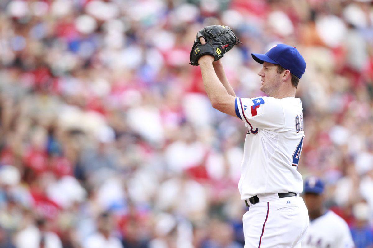 Jul 8, 2012; Arlington, TX, USA; Texas Rangers starting pitcher Roy Oswalt (44) winds up during the fourth inning of the game against the Minnesota Twins at Rangers Ballpark. Mandatory Credit: Tim Heitman-US PRESSWIRE