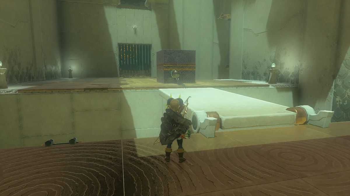 The first step of the Musanokir Shrine in The Legend of Zelda: Tears of the Kingdom. Attach the metal ball to the large metal cube to raise the bridge.