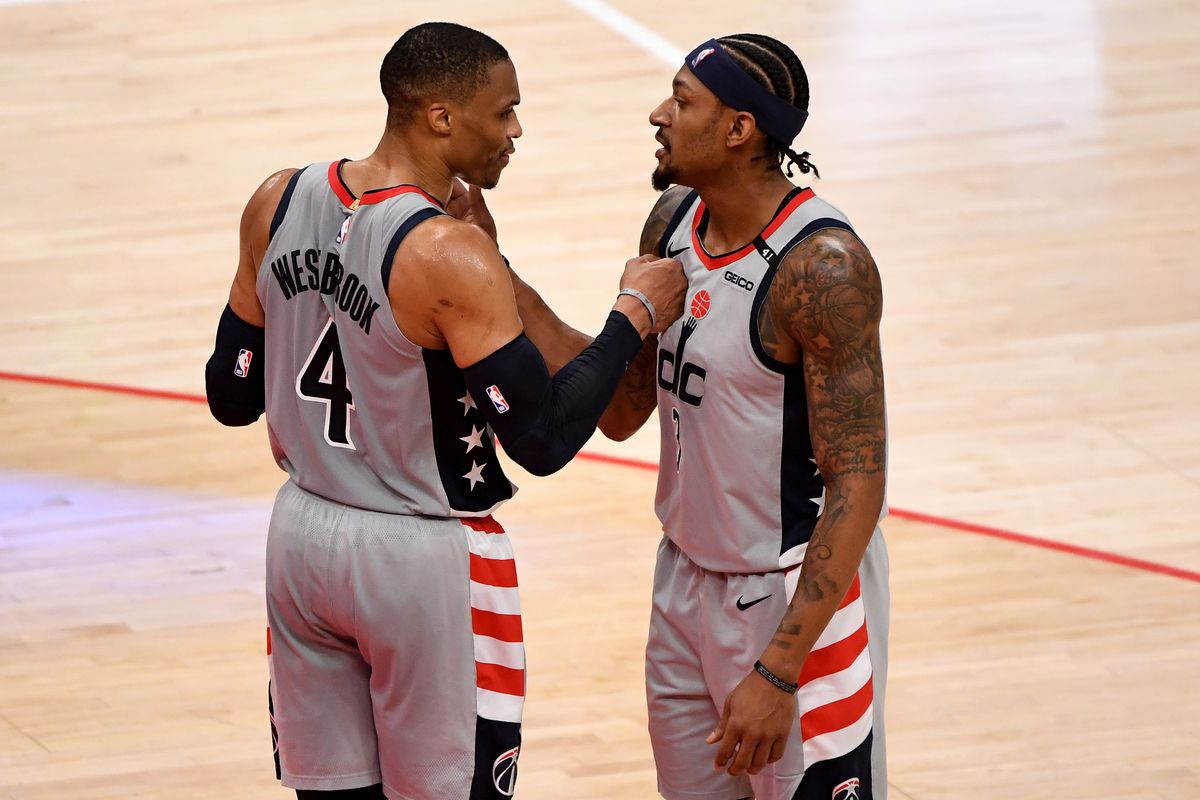 Russell Westbrook and Bradley Beal of the Washington Wizards celebrate after defeating the Charlotte Hornets at Capital One Arena on May 16, 2021 in Washington, DC.