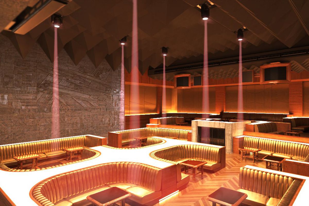 A nightclub space with gold furnishings 