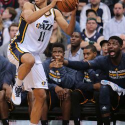 Utah Jazz guard Dante Exum (11) saves a ball and looks for an open teammate as the Utah Jazz play the Indiana Pacers Monday, Jan. 5, 2015, at EnergySolutions Arena in Salt Lake City.