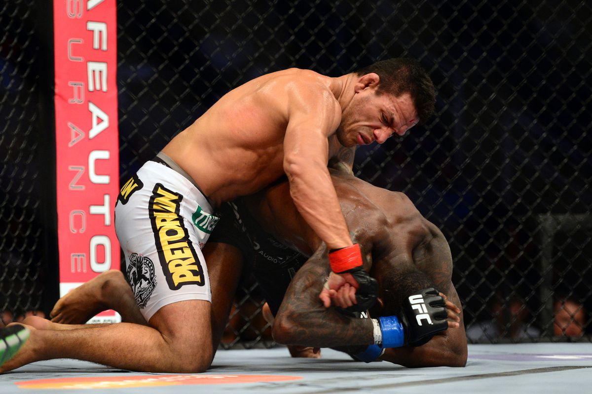 July 11, 2012; San Jose, CA, USA; Rafael Dos Anjos (top) fights Anthony Njokuani (bottom) during the lightweight bout of the UFC on Fuel TV at HP Pavilion. Mandatory Credit: Kyle Terada-US PRESSWIRE
