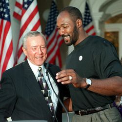 Sen. Orrin Hatch, R-Utah, hugs Utah Jazz forward Karl Malone during a fundraiser for Hatch's presidential campaign.