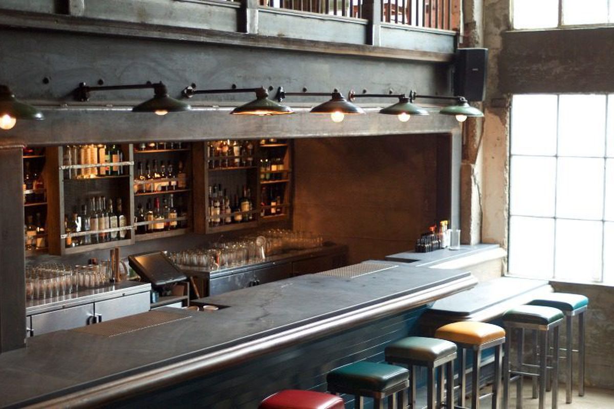 The main bar, with repurposed ship yard lights overhead. 