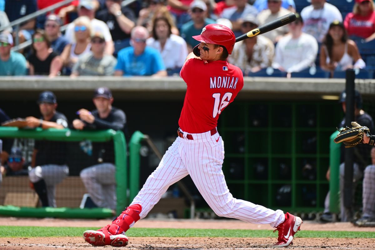 Mickey Moniak #16 of the Philadelphia Phillies hits an RBI double in the third inning against the New York Yankees during a Grapefruit League spring training game at BayCare Ballpark on March 31, 2022 in Clearwater, Florida.