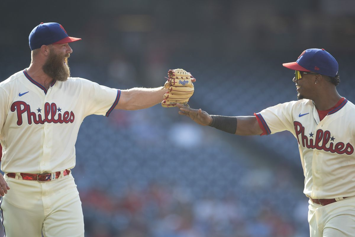 Archie Bradley #23 and Jean Segura #2 of the Philadelphia Phillies react against the Miami Marlins during Game One of the doubleheader at Citizens Bank Park on July 16, 2021 in Philadelphia, Pennsylvania.