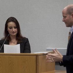 Witness Gypsy Willis reviews a document handed to her by prosecutor Chad Grunander, right, during a preliminary hearing in the case of Martin MacNeill at the Fourth District Court in Provo Wednesday, Oct. 10, 2012. 