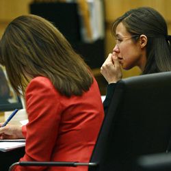 Defendant Jodi Arias, right, listens to defense attorney Kirk Nurmi make his closing arguments during her trial on Friday, May 3, 2013 at Maricopa County Superior Court in Phoenix.  Arias is charged with first-degree murder in the stabbing and shooting death of Travis Alexander, 30, in his suburban Phoenix home in June 2008. 