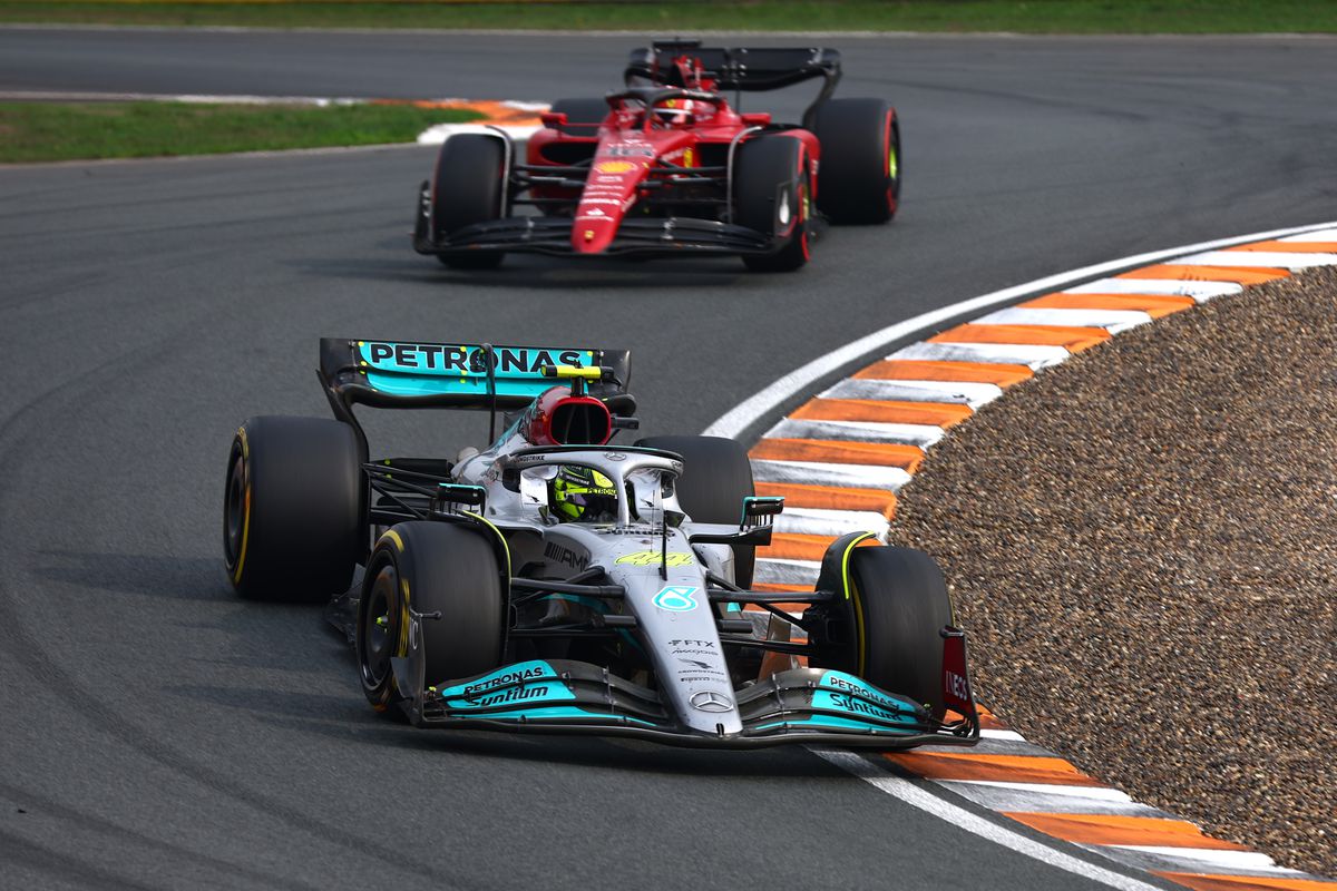 Lewis Hamilton of Great Britain driving the (44) Mercedes AMG Petronas F1 Team W13 leads Charles Leclerc of Monaco driving (16) the Ferrari F1-75 during the F1 Grand Prix of The Netherlands at Circuit Zandvoort on September 04, 2022 in Zandvoort, Netherlands.