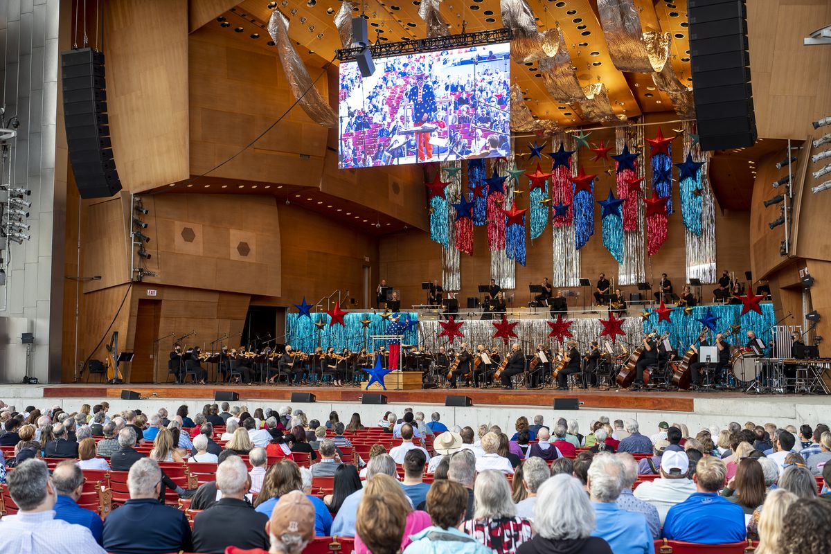 Concertgoers listen to the Grant Park Orchestra at the Pritzker Pavilion during the Grant Park Music Festival’s Independence Day Salute in Millennium Park on July 2, 2021.