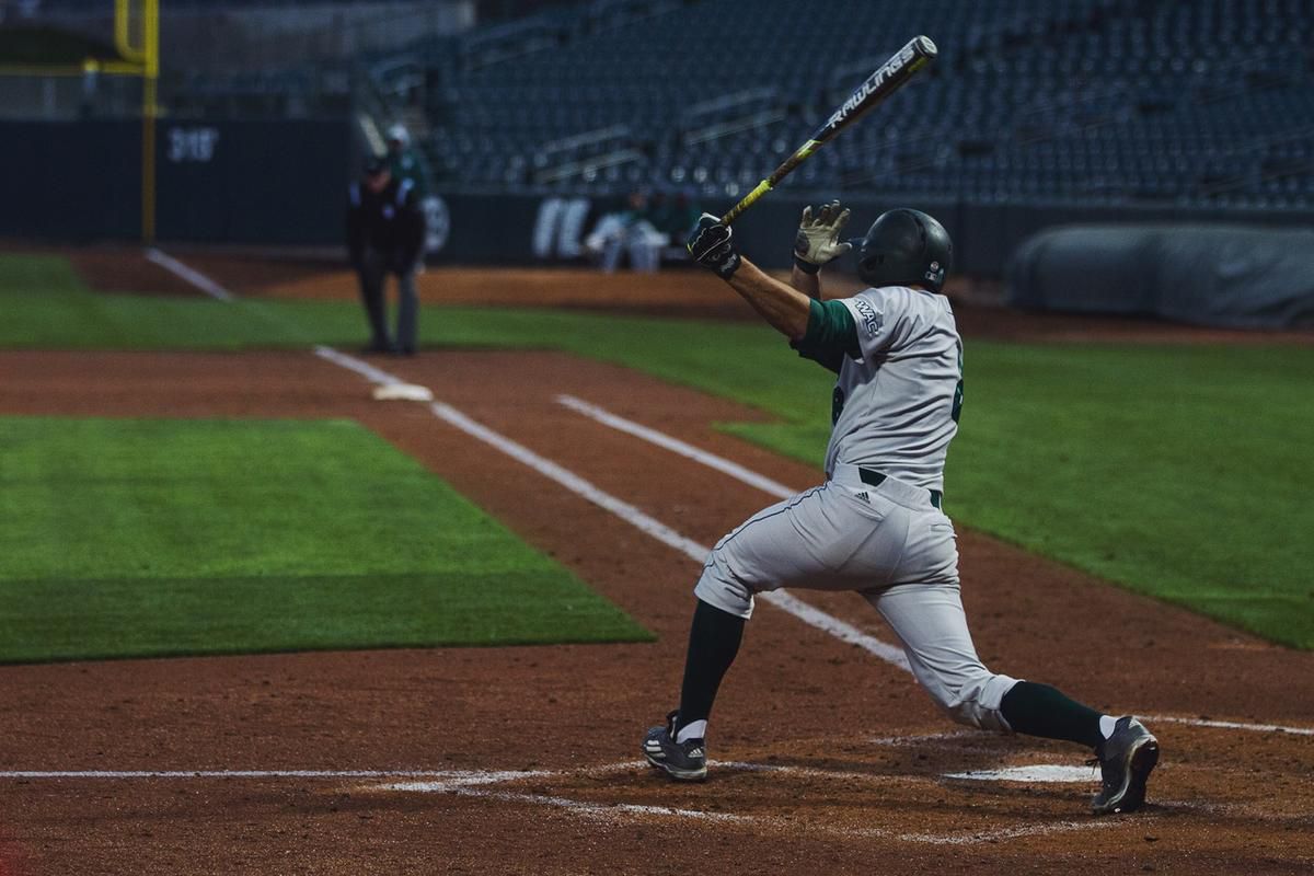 Jake Atkinson hits a triple that scored a pair of runs for Utah Valley in the sixth inning of a 7-6 win over Utah on Wednesday night in Salt Lake City.