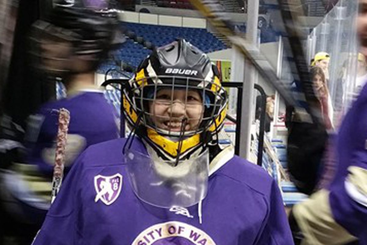 Washington Huskies goaltender Debbie Chen poses for a quick photo op after her first win on Sunday in Portland.