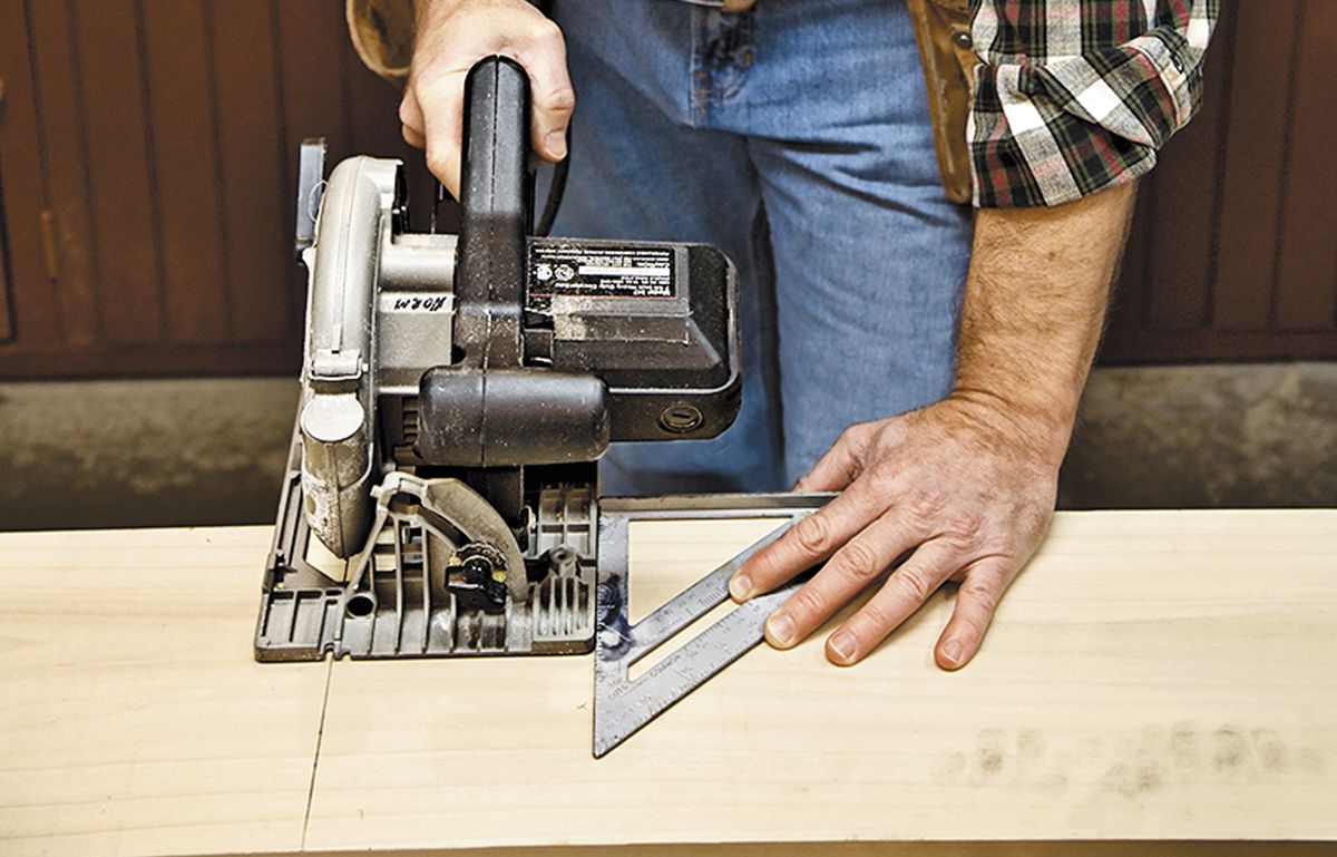 <p>Master carpenter Norm Abram uses a speed square to guide a straight crosscut with a circular saw</p>