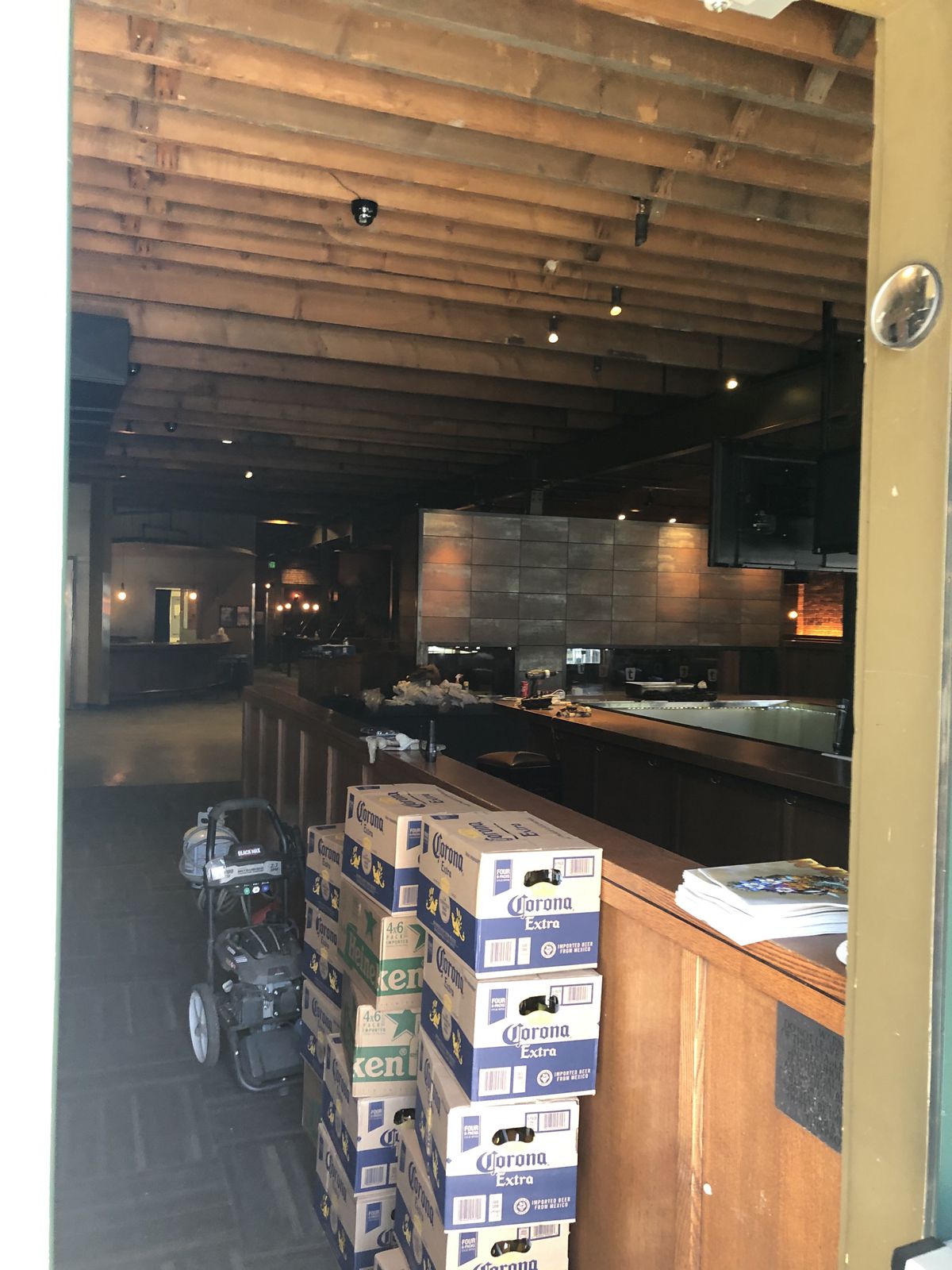 A picture taken into the now-shuttered Cowboy Lounge showing stacked beer boxes near the door