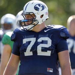 Ryker Mathews a Freshman Offensive lineman watches during a play as BYU football practices Thursday, Aug. 11, 2011.