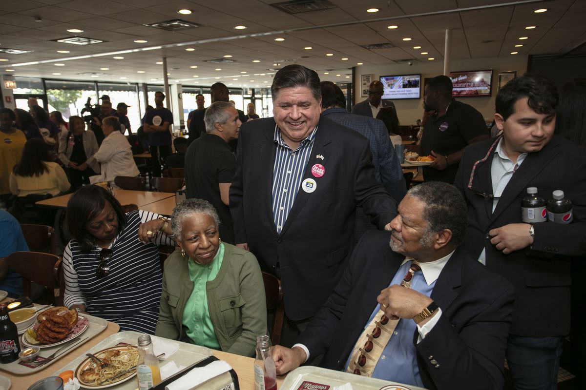 Illinois Governor J.B. Pritzker (C) speaks to supporters on Primary Day at Manny’s Deli on June 28, 2022 in Chicago, Illinois. Voters will be deciding on candidates for governor, secretary of state, and several other key positions in state government.