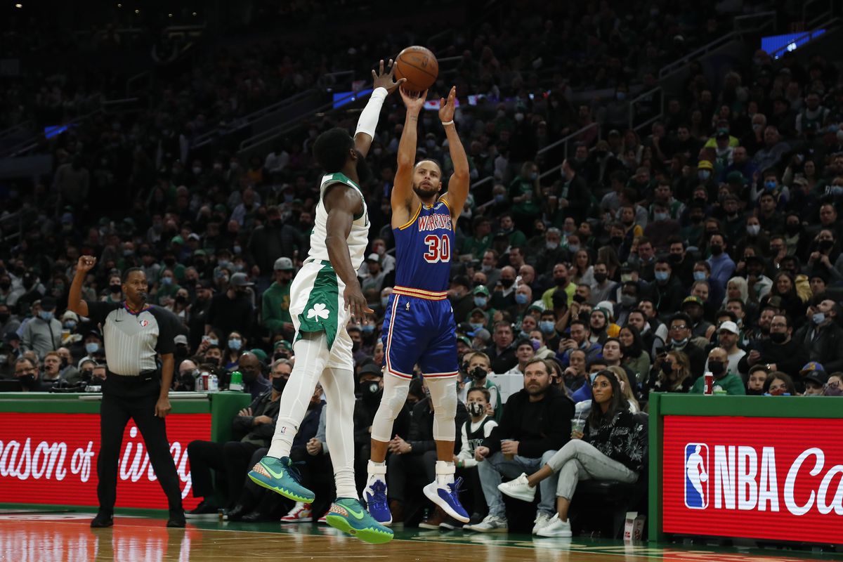 Golden State Warriors guard Stephen Curry (30) shots over Boston Celtics guard Jaylen Brown (7) during the first quarter at TD Garden.
