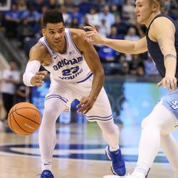 Brigham Young Cougars forward Yoeli Childs (23) passes around San Diego Toreros forward Alex Floresca (15) at the Marriott Center in Provo on Saturday, Jan. 20, 2018.
