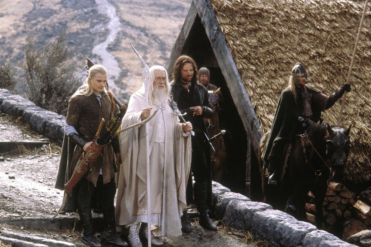Legolas (Orlando Bloom) and Aragorn (Viggo Mortensen) escort Gandalf (Ian McKellen) to the stables of Edoras in New Line Cinema? epic adventure, The Lord of the Rings:  The Return of the King.                                                               