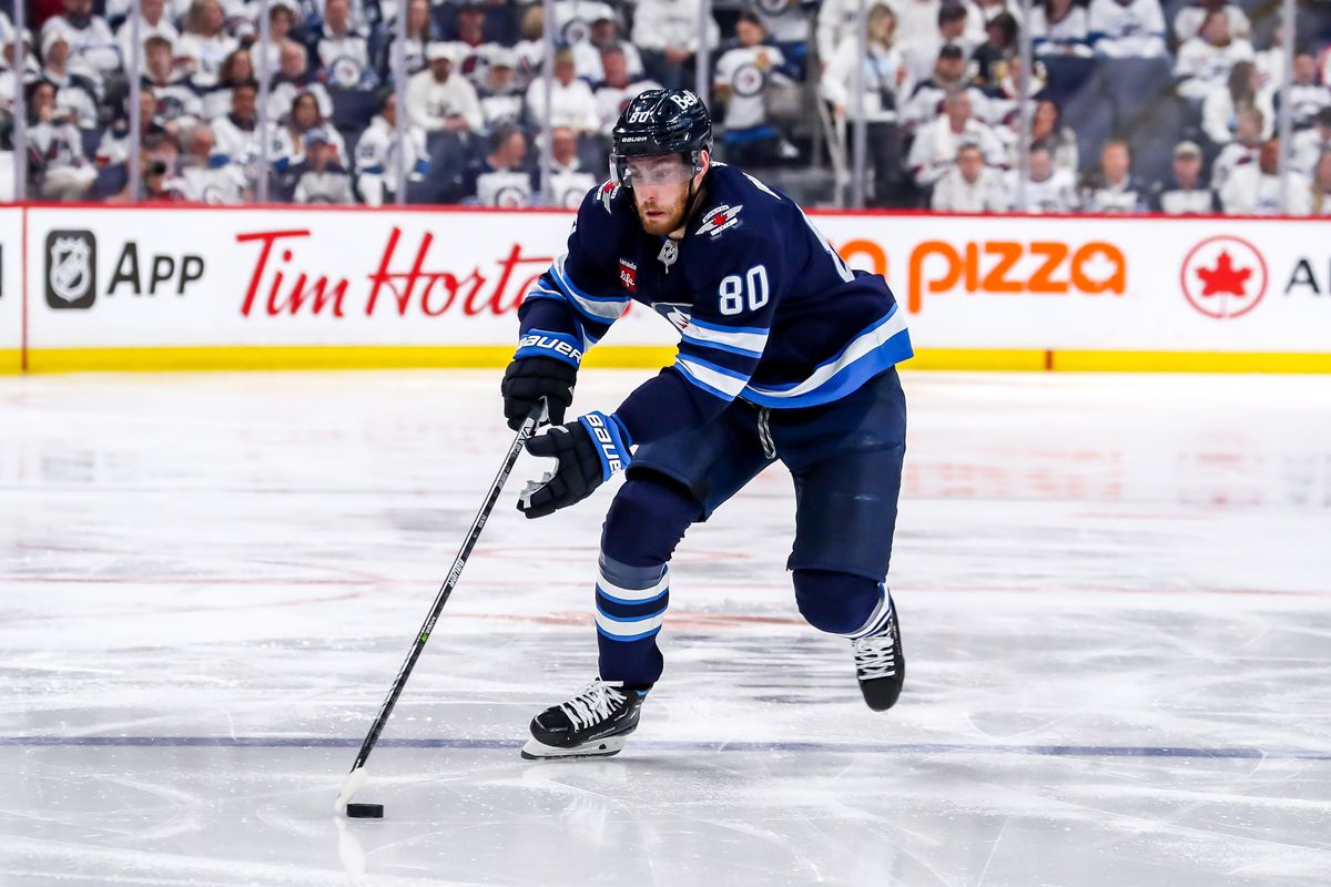 Pierre-Luc Dubois of the Winnipeg Jets plays the puck down the ice during second period action against the Vegas Golden Knights in Game Four of the First Round of the 2023 Stanley Cup Playoffs at the Canada Life Centre on April 24, 2023 in Winnipeg, Manitoba, Canada. The Knights defeated the Jets 4-2 and lead the series 3-1.