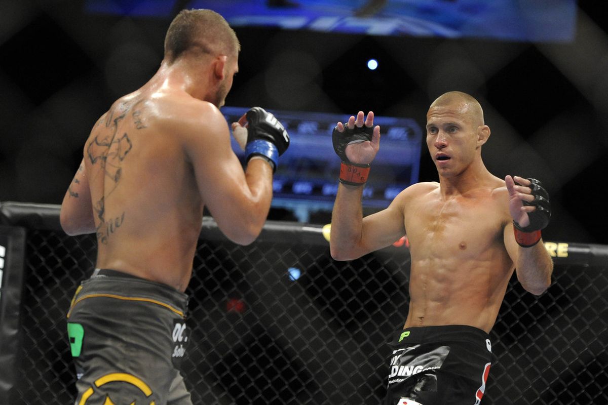 May 15, 2012; Fairfax, VA, USA; Donald Cerrone (right) taunts his opponent, Jeremy Stephens (left), during the Korean zombie vs Poirier event at Patriot Center.  Mandatory Credit: Rafael Suanes-US PRESSWIRE