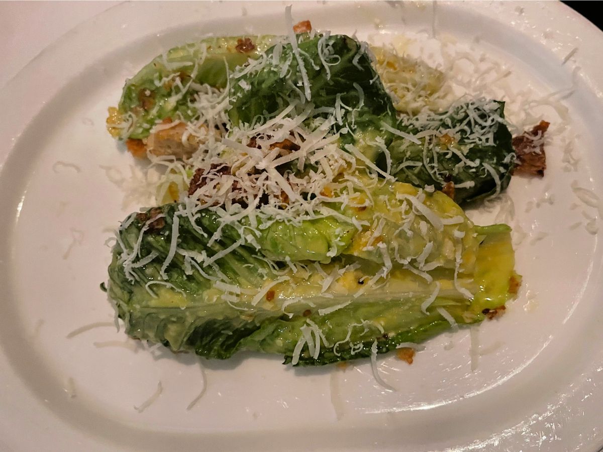 A serving of whole-leaf Caesar salad.