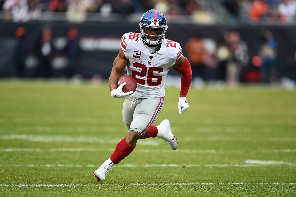 Saquon Barkley of the New York Giants runs for yards during a game against the Chicago Bears at Soldier Field on November 24, 2019 in Chicago, Illinois.